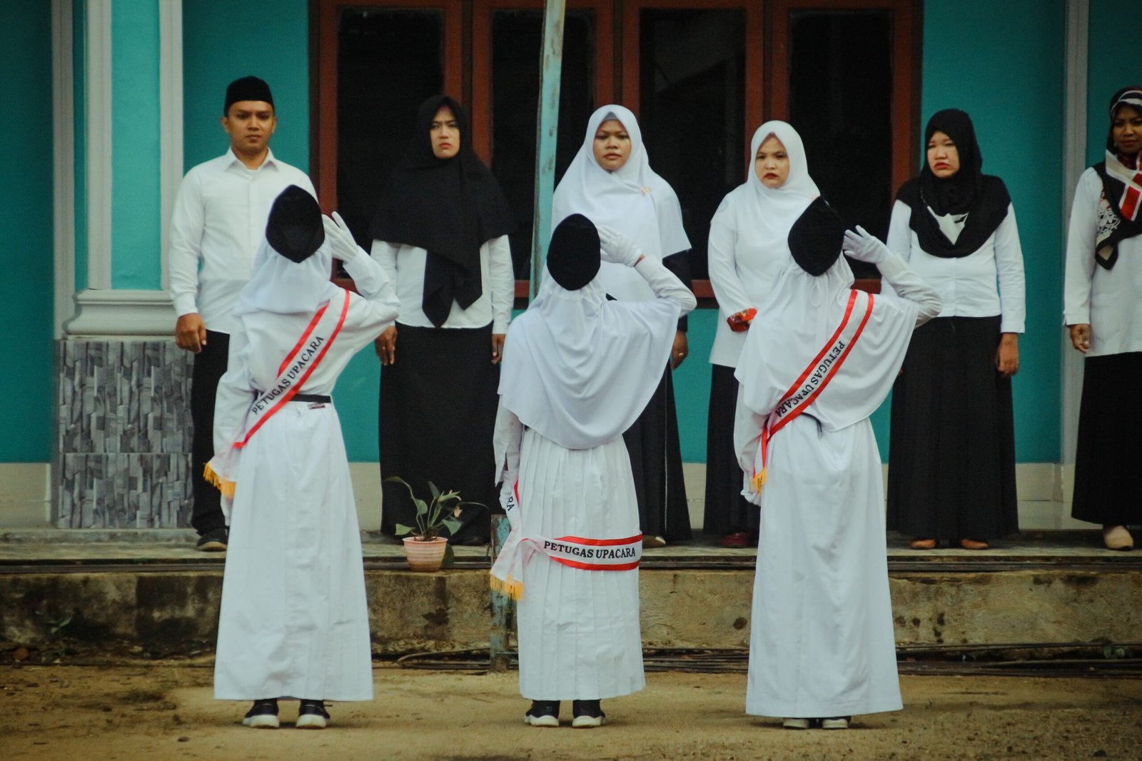 a group of people in white robes